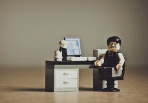 Lego man sitting at recruitment desk in perth worries about Linkedin